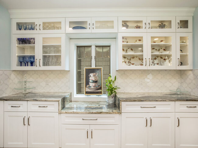 white kitchen sink and window