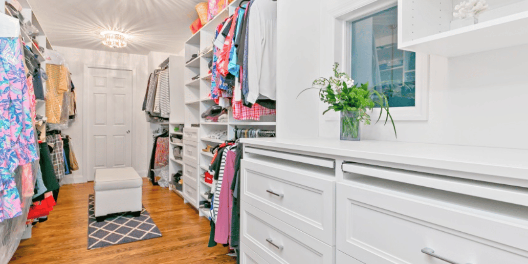 custom walk-in closet design with shoe storage