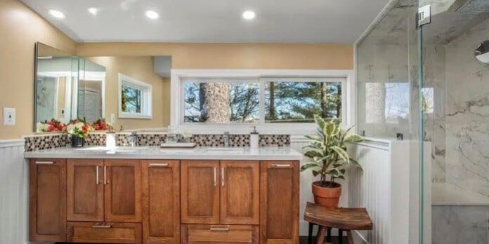 Dreamstyle Kitchen UGC – 21 Narrow galley-style kitchen featuring modern white cabinetry and sleek black countertops